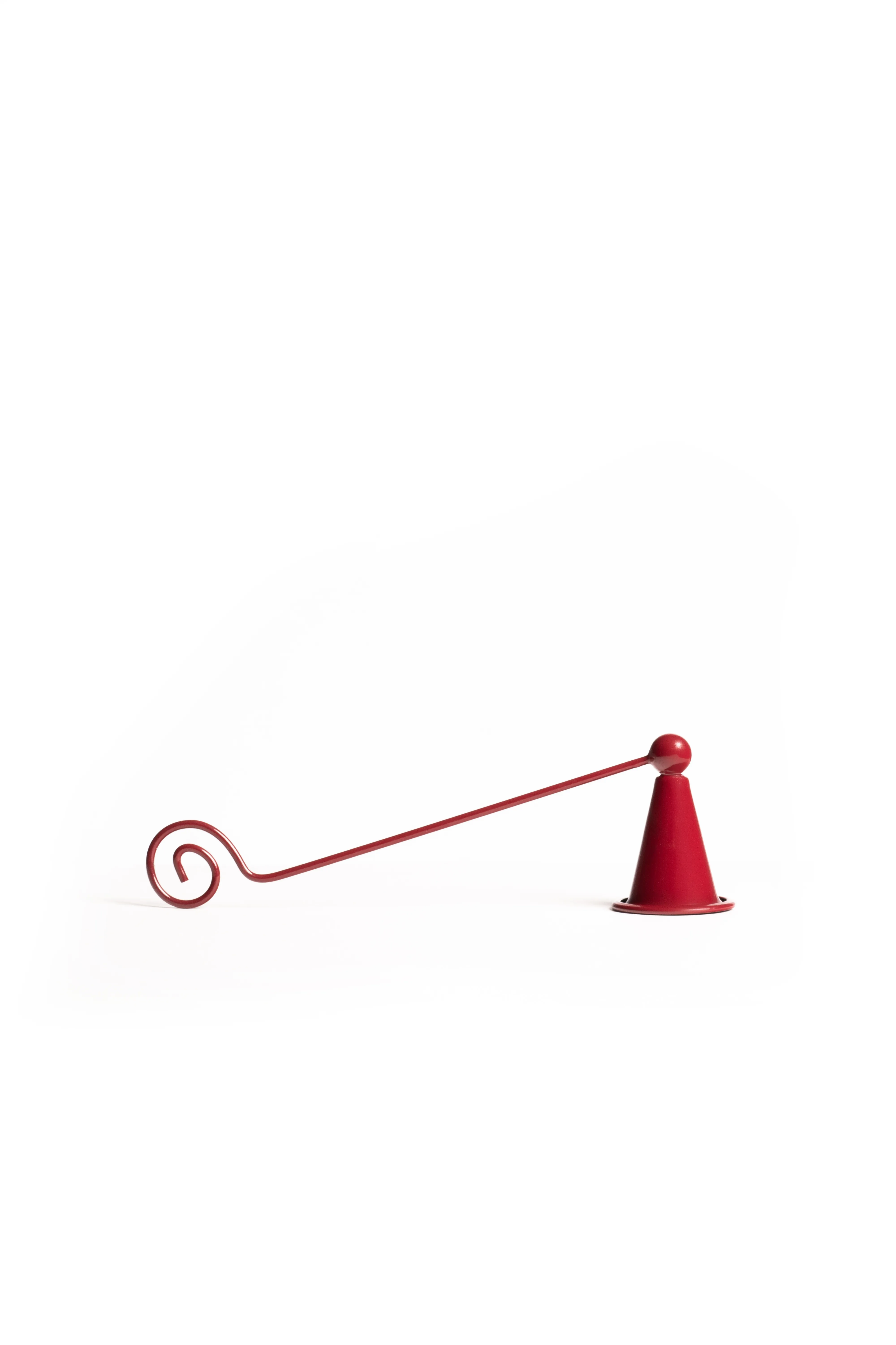 The full red candle snuffer with its curled handle end against a white background.